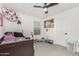 Bright bedroom with window coverings and ceiling fan at 11311 E Upton Ave, Mesa, AZ 85212