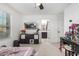 Bedroom with TV, dresser, and bathroom access at 11311 E Upton Ave, Mesa, AZ 85212