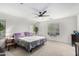 Main bedroom with ceiling fan and large windows at 11311 E Upton Ave, Mesa, AZ 85212
