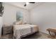 Well-lit bedroom with a comfortable bed and nightstand at 11311 E Upton Ave, Mesa, AZ 85212