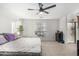 Main bedroom with ceiling fan and ensuite bathroom at 11311 E Upton Ave, Mesa, AZ 85212