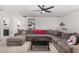 Spacious bonus room with sectional sofa and bathroom view at 11311 E Upton Ave, Mesa, AZ 85212