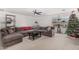 Spacious bonus room with sectional sofa and Christmas tree at 11311 E Upton Ave, Mesa, AZ 85212