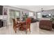 Bright dining area with a wooden table and chairs near the living room at 11311 E Upton Ave, Mesa, AZ 85212