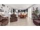 Open dining room with wood table and kitchen view at 11311 E Upton Ave, Mesa, AZ 85212