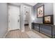 Bright entryway with wood-look floors, showcasing a view into the home at 11311 E Upton Ave, Mesa, AZ 85212