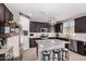 Modern kitchen with granite island and dark cabinets at 11311 E Upton Ave, Mesa, AZ 85212