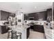 Modern kitchen with granite island and dark cabinetry at 11311 E Upton Ave, Mesa, AZ 85212