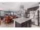 Kitchen with granite island, open to dining area, and stainless steel appliances at 11311 E Upton Ave, Mesa, AZ 85212