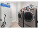 Laundry room with washer, dryer, and refrigerator at 11311 E Upton Ave, Mesa, AZ 85212