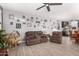Comfortable living room with brown sofas and decorative wall at 11311 E Upton Ave, Mesa, AZ 85212
