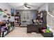 Home office with desk, bookshelves, and Star Wars decor at 11311 E Upton Ave, Mesa, AZ 85212