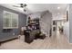 Home office with desk, bookshelves, and view into dining area at 11311 E Upton Ave, Mesa, AZ 85212