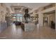 Spacious lobby with stone fireplace and western-themed art at 11500 E Cochise Dr # 1099, Scottsdale, AZ 85259