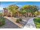 Two-story stucco building with walkway and desert landscaping at 11500 E Cochise Dr # 1099, Scottsdale, AZ 85259