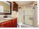 Bathroom with granite vanity and updated shower at 15627 W Acapulco Ln, Surprise, AZ 85379