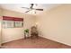 Bedroom with ceiling fan and window coverings at 15627 W Acapulco Ln, Surprise, AZ 85379