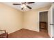 Bedroom with ceiling fan and adjacent storage at 15627 W Acapulco Ln, Surprise, AZ 85379