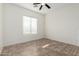 Bright bedroom with tile flooring and ceiling fan at 16217 N 182Nd Ln, Surprise, AZ 85388