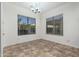 Dining area with tile flooring and large windows at 16217 N 182Nd Ln, Surprise, AZ 85388