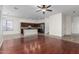 Open kitchen with island, stainless steel appliances, and dark wood cabinets at 16217 N 182Nd Ln, Surprise, AZ 85388