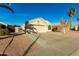 One-story house with a two-car garage and desert landscaping at 1626 W Kesler Ln, Chandler, AZ 85224