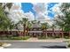 Brick community center with palm trees and landscaping at 18133 W Las Cruces Dr, Goodyear, AZ 85338