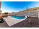 Inviting pool and spa with a waterfall feature and spacious patio at 18133 W Las Cruces Dr, Goodyear, AZ 85338