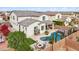Stunning aerial view of a house with a pool and landscaped backyard at 18407 W Fulton St, Goodyear, AZ 85338