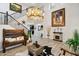 Rustic entryway with a wooden bench and antler chandelier at 18407 W Fulton St, Goodyear, AZ 85338