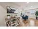 Bright living room with hardwood floors and a stylish farmhouse-style console table at 18407 W Fulton St, Goodyear, AZ 85338