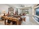 Living room with leather furniture, built-in shelving, and pool view at 18407 W Fulton St, Goodyear, AZ 85338