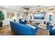 Spacious living room with a built-in entertainment center and hardwood floors at 18407 W Fulton St, Goodyear, AZ 85338
