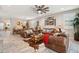 Living room with leather sofas, a large TV, and western-themed decor at 18407 W Fulton St, Goodyear, AZ 85338