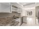 Kitchen with granite countertops and white cabinets at 1927 E Duke Dr, Tempe, AZ 85283