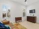 Bright sitting room with large windows and neutral tones at 19702 E Melissa Pl, Queen Creek, AZ 85142