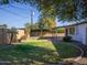 Expansive grassy backyard with mature trees at 3308 W Surrey Ave, Phoenix, AZ 85029