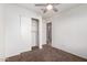 Bright bedroom with ceiling fan and built-in shelving at 3415 E Escuda Rd, Phoenix, AZ 85050