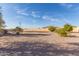 Landscaped backyard with gravel and small lawn area at 34720 W Durango St, Tonopah, AZ 85354