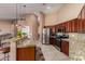 Open kitchen with granite countertops and ample cabinet space at 34720 W Durango St, Tonopah, AZ 85354