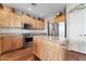 Modern kitchen with wood cabinets and granite countertops at 4091 S Hackberry Trl, Gold Canyon, AZ 85118