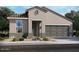 One-story home with tile roof, two-car garage, and desert landscaping at 41885 W Hospitality Ln, Maricopa, AZ 85138