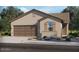 One-story home with two-car garage and desert landscaping at 41895 W Hospitality Ln, Maricopa, AZ 85138