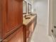 Double vanity bathroom with granite countertops and wood cabinets at 5221 W Sandra Ter, Glendale, AZ 85306