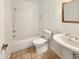 Clean bathroom with shower/tub combo and tile floors at 5221 W Sandra Ter, Glendale, AZ 85306