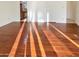 Bright bedroom with hardwood floors and access to a bathroom at 5221 W Sandra Ter, Glendale, AZ 85306