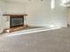 Spacious living room with a fireplace and large windows at 5221 W Sandra Ter, Glendale, AZ 85306