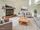 Bright living room featuring a fireplace and comfy seating at 5221 W Sandra Ter, Glendale, AZ 85306