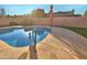 Inviting kidney-shaped pool with surrounding patio at 5221 W Sandra Ter, Glendale, AZ 85306