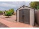 Large storage shed in the backyard with brick pathway at 5630 W Kesler St, Chandler, AZ 85226